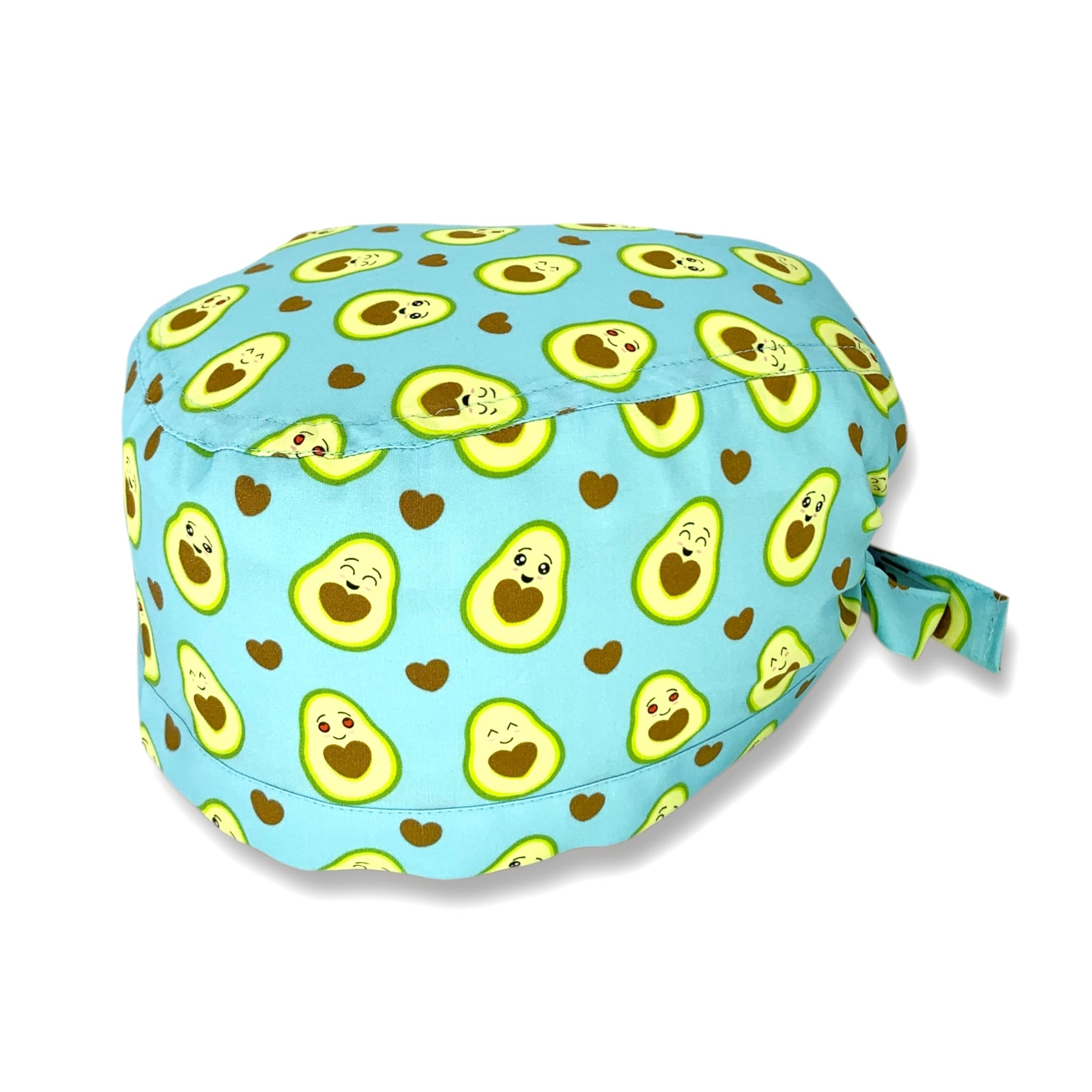 Cuffietta chirurgica con simpatici avocado tagliati a metà svelano un cuore morbido. Deliziose tonalità di verde e marrone che si abbinano perfettamente sulla base azzurro.