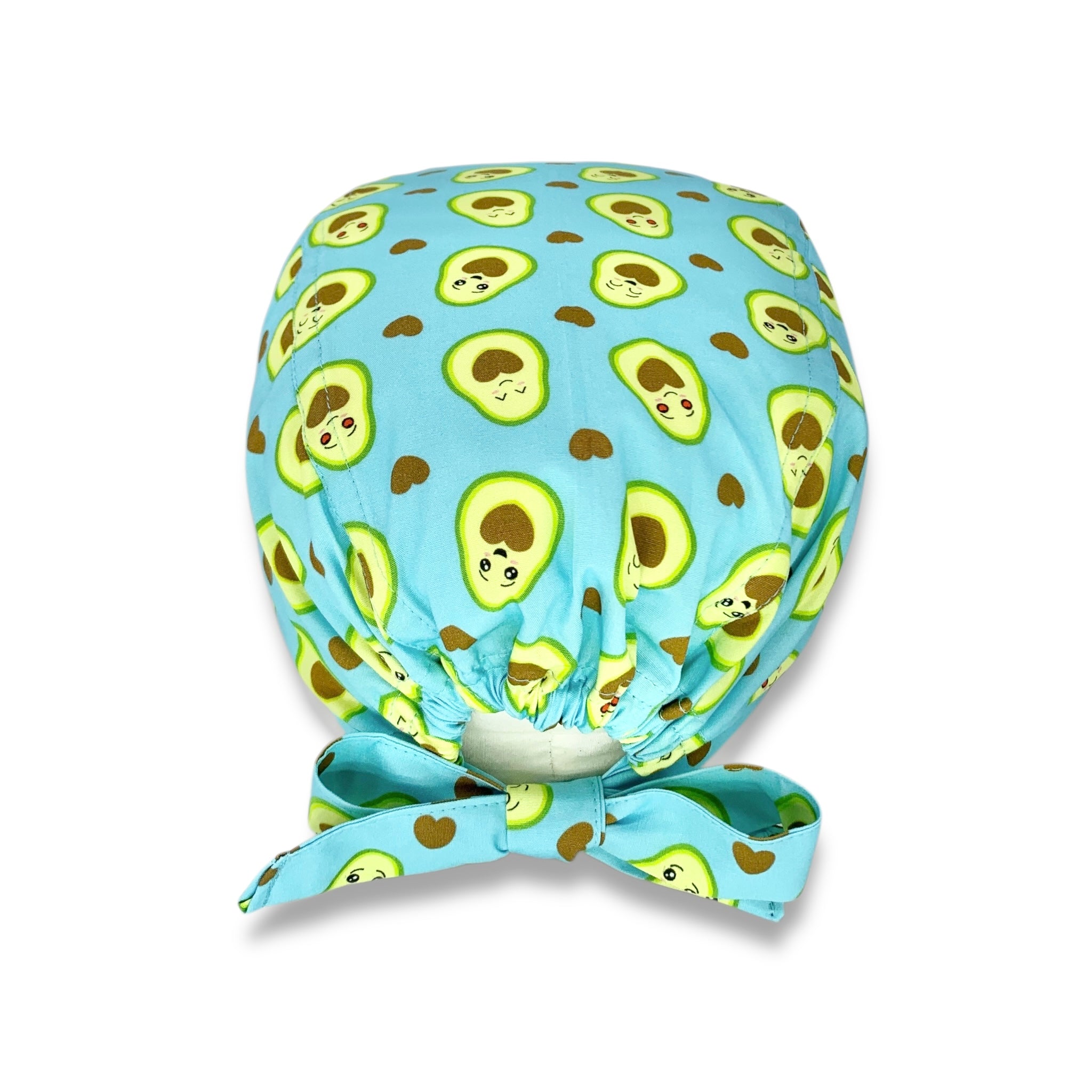 Cuffietta chirurgica con simpatici avocado tagliati a metà svelano un cuore morbido. Deliziose tonalità di verde e marrone che si abbinano perfettamente sulla base azzurro.