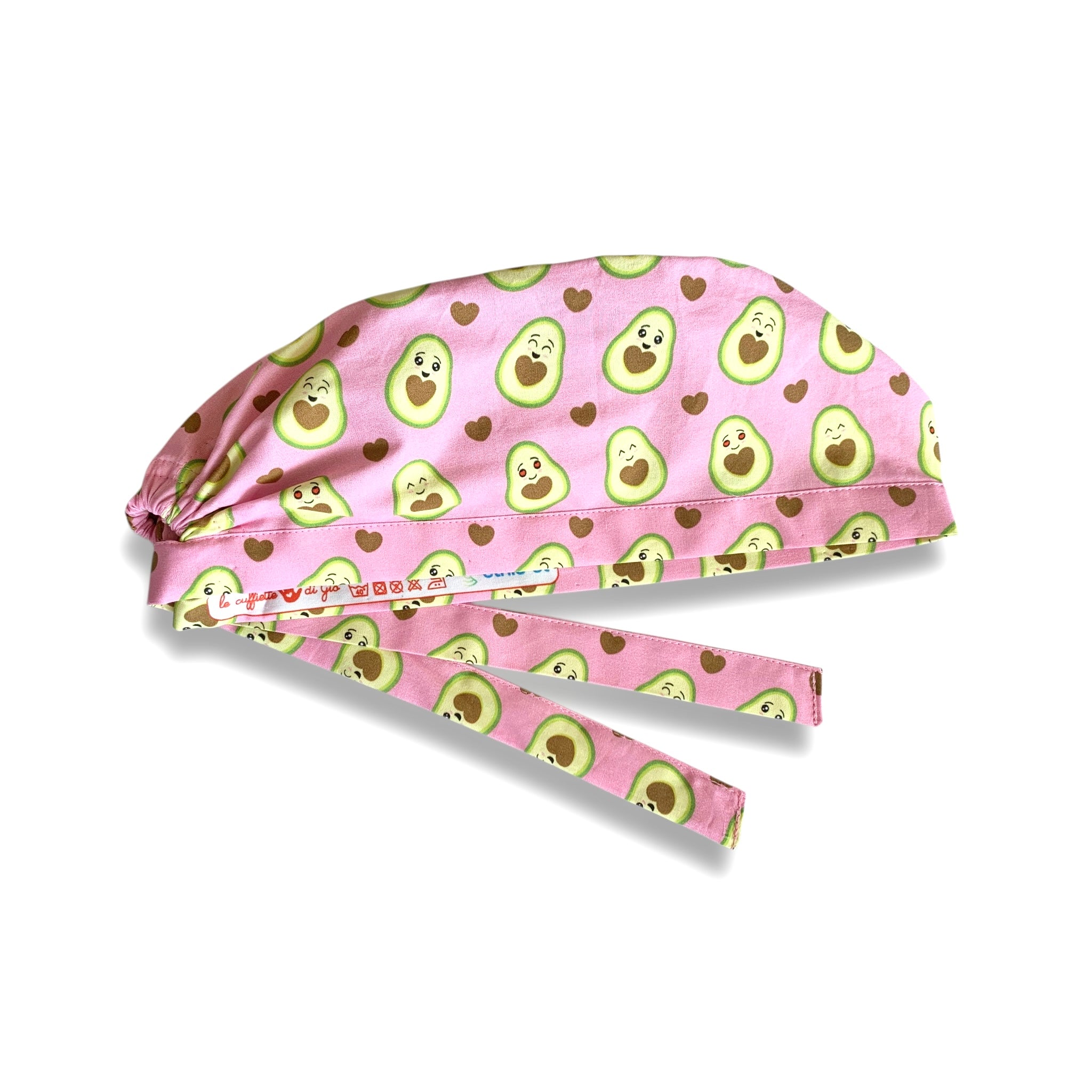 Cuffietta chirurgica con simpatici avocado tagliati a metà svelano un cuore morbido. Deliziose tonalità di verde e marrone che si abbinano perfettamente sulla base rosa.