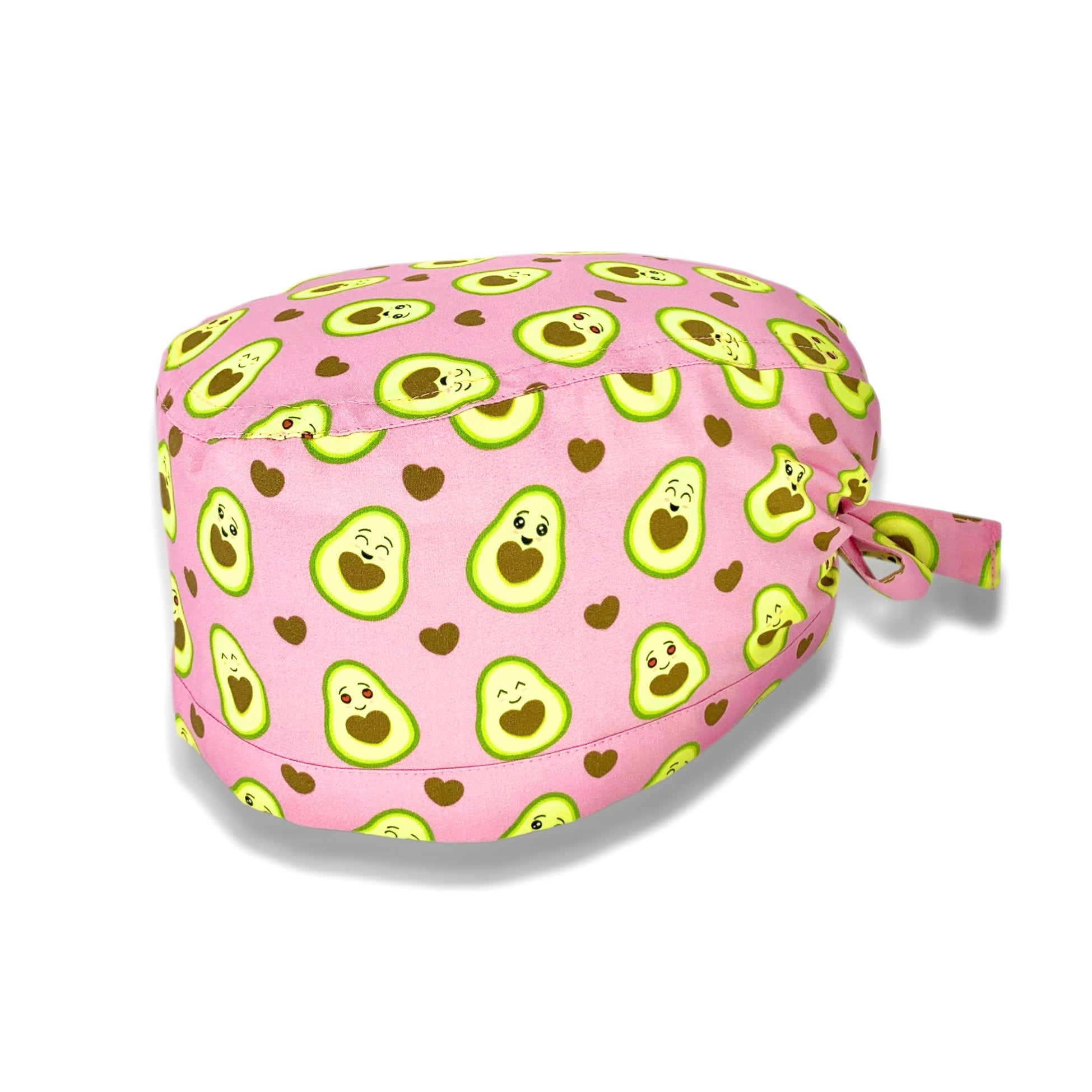 Cuffietta chirurgica con simpatici avocado tagliati a metà svelano un cuore morbido. Deliziose tonalità di verde e marrone che si abbinano perfettamente sulla base rosa.
