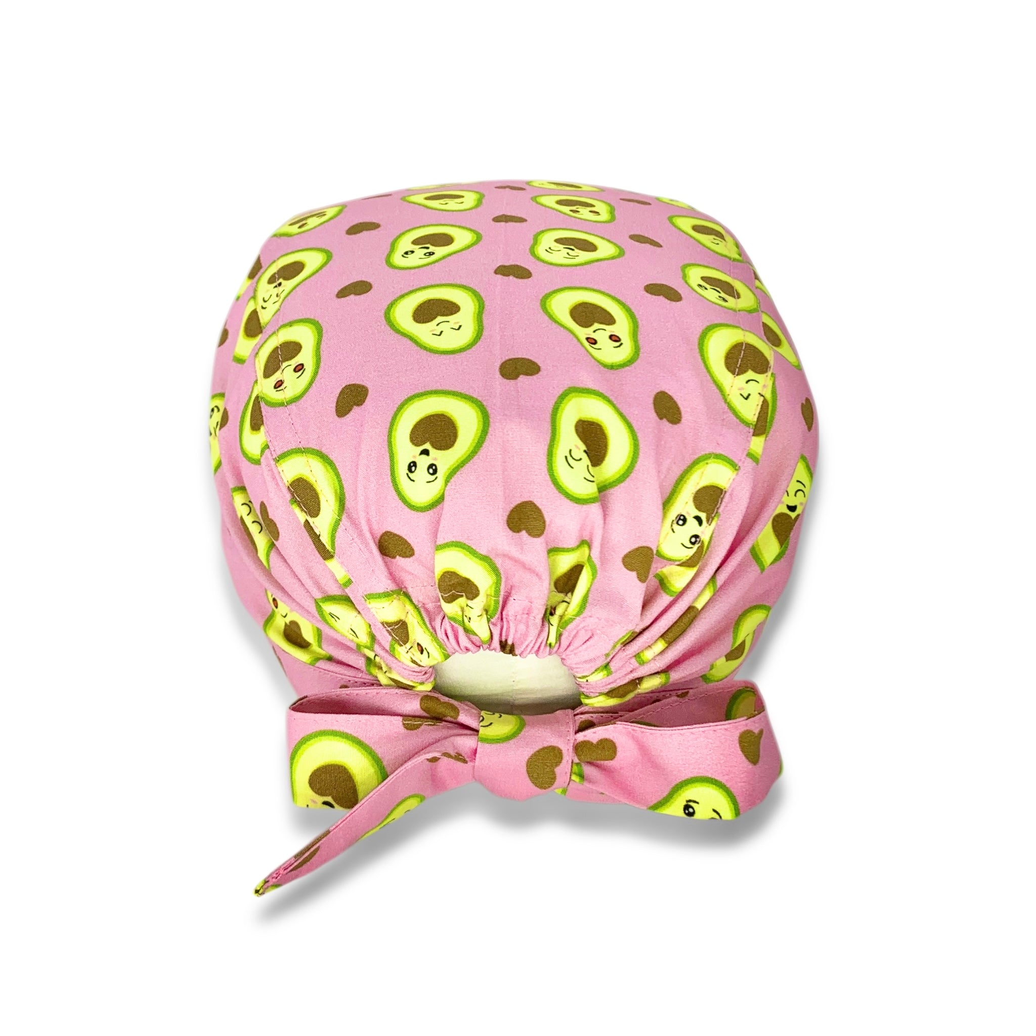Cuffietta chirurgica con simpatici avocado tagliati a metà svelano un cuore morbido. Deliziose tonalità di verde e marrone che si abbinano perfettamente sulla base rosa.