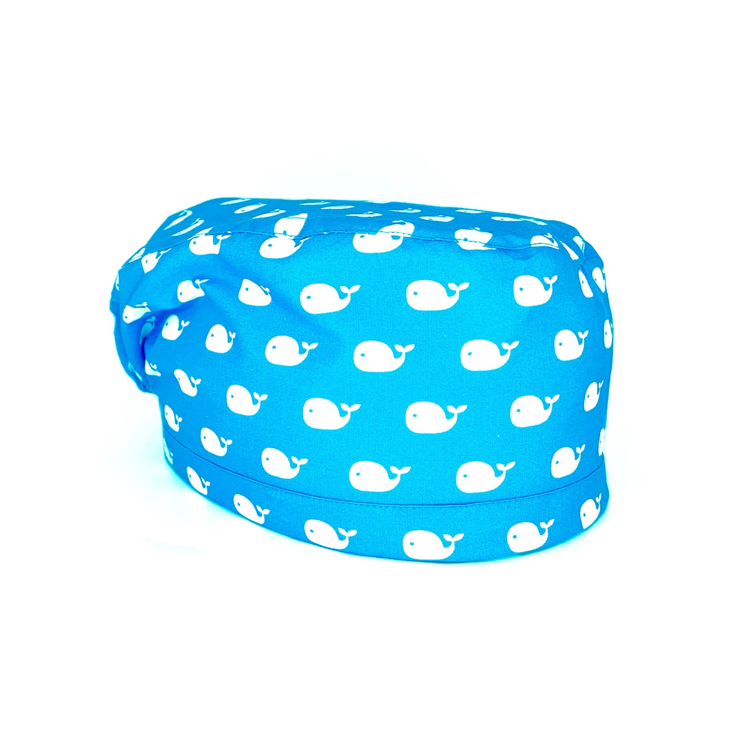 immagine laterale cuffia medica a fondo azzurro. Stampate Tante piccole balene bianche