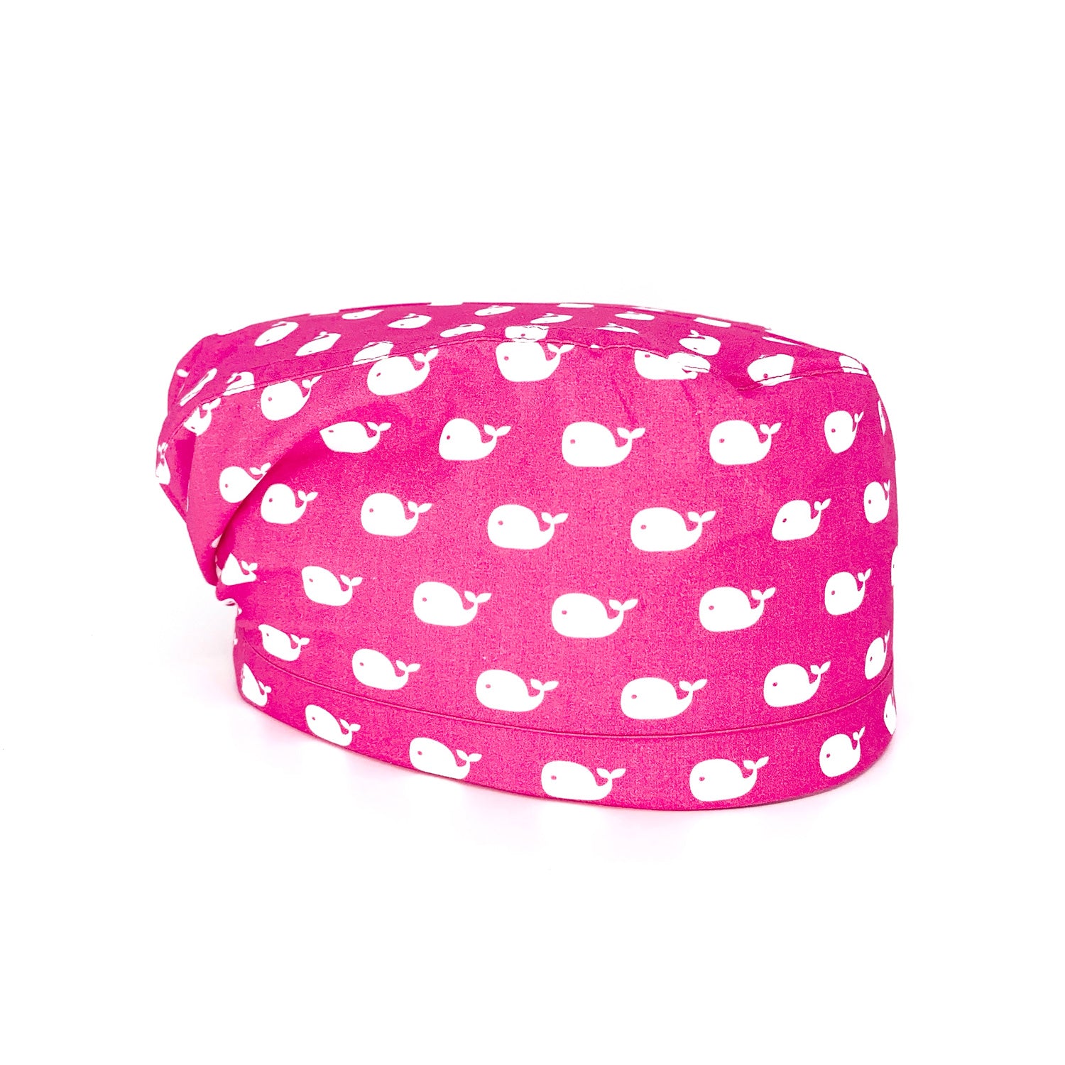 immagine laterale cuffia medica Tante piccole balene bianche stampate su fondo fucsia