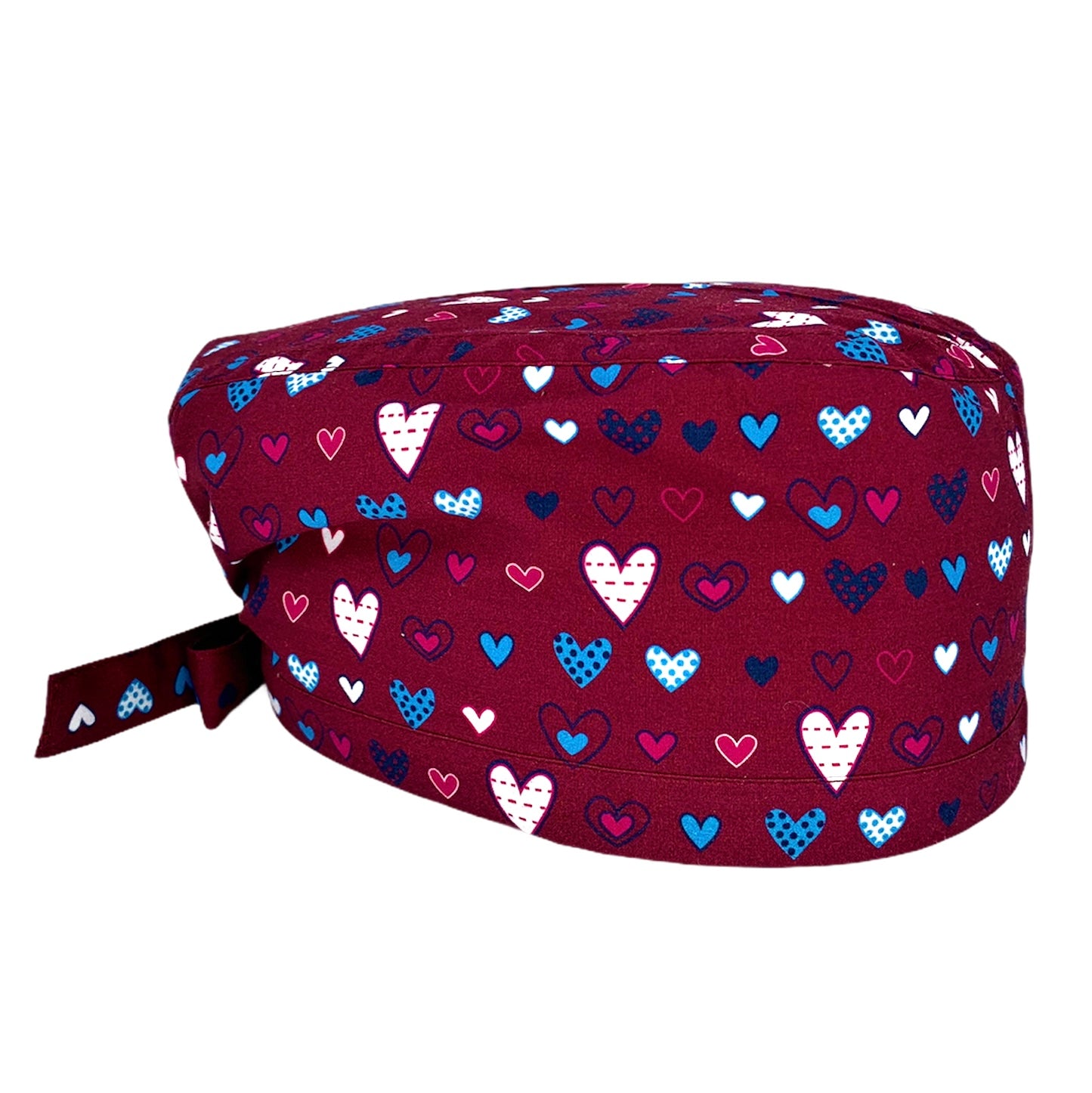 Cuoricini sparsi di forme diverse magenta bianchi e azzurri su base bordeaux