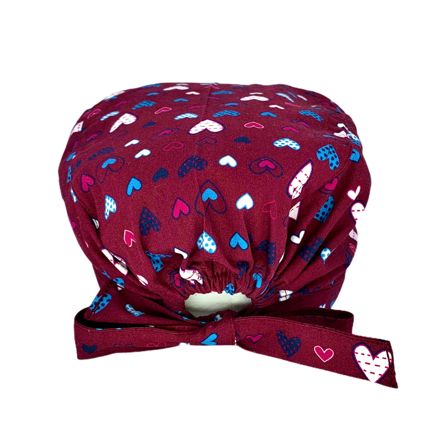 Cuoricini sparsi di forme diverse magenta bianchi e azzurri su base bordeaux