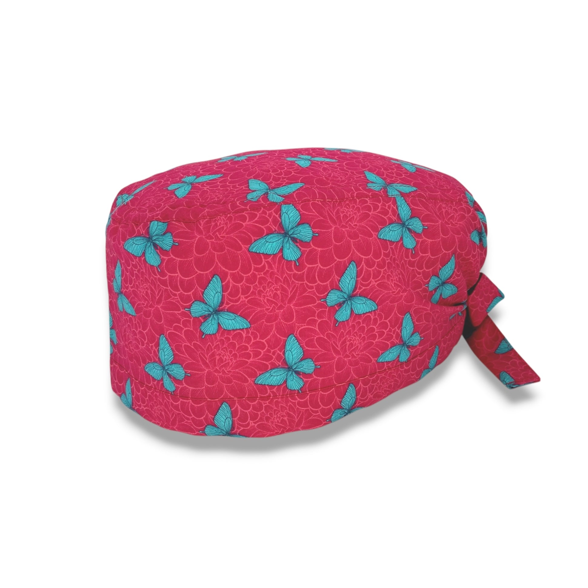 Un'elegantissima fantasia con dalie sfumate tono su tono e delicate farfalle a contrasto; farfalle verde menta su sfondo magenta