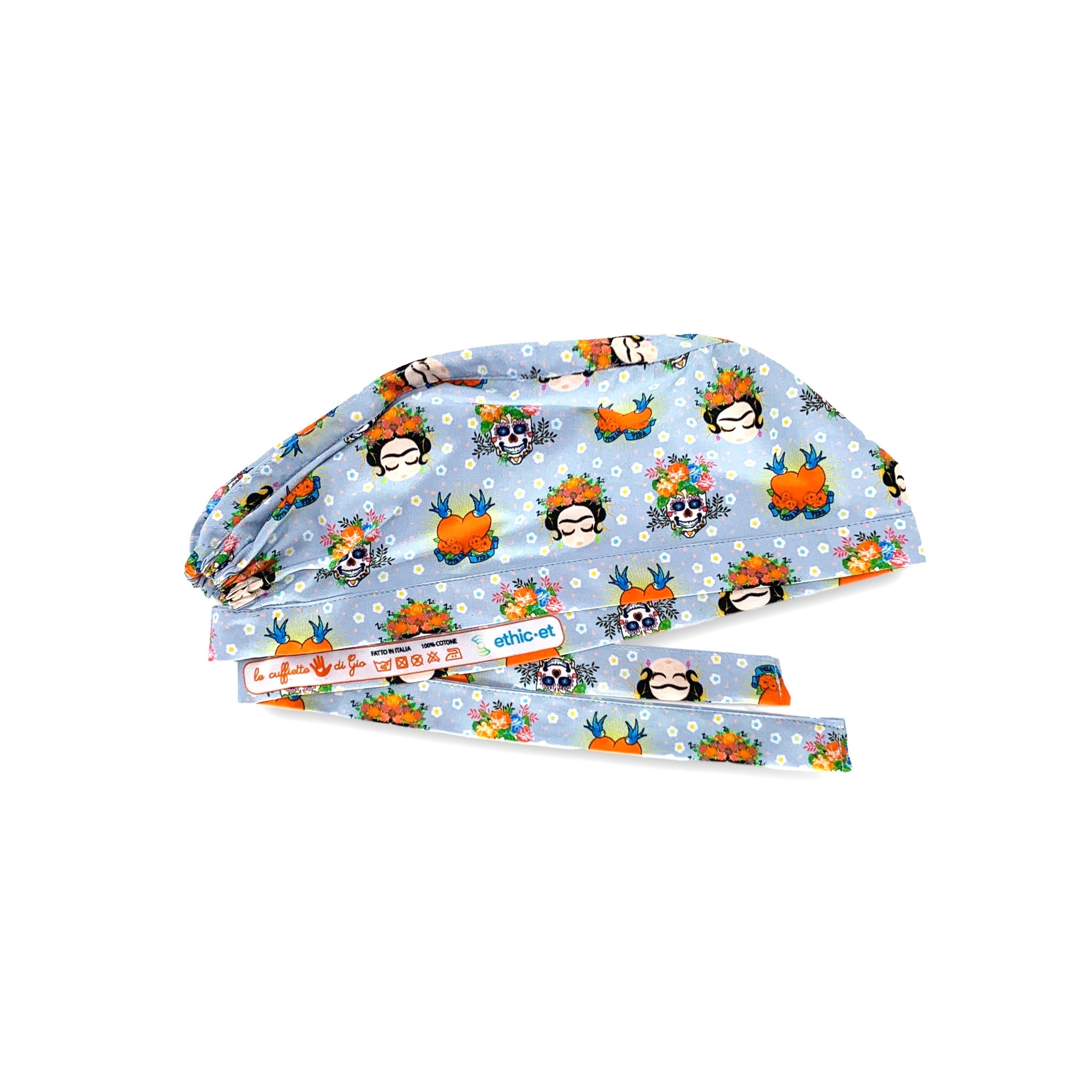 Cuffietta medica che rappresenta un volto iconico della storia dell'arte e della cultura mondiale, quello di Frida Khalo e alcuni simboli che rappresentano la sua storia, il teschio e la frase "Viva la Vida"