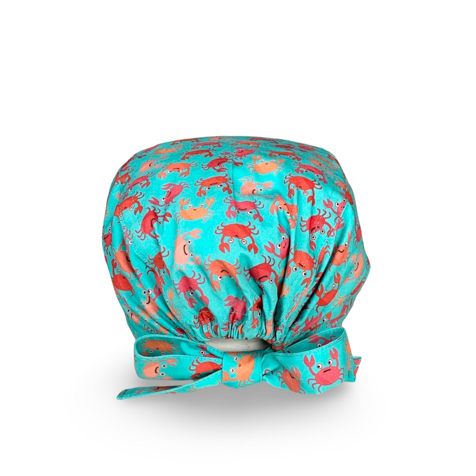 Una cuffia chirurgica simpatica ed elegante al tempo stesso, con una miriade di granchietti colorati tono su tono rispetto alla base verde acqua