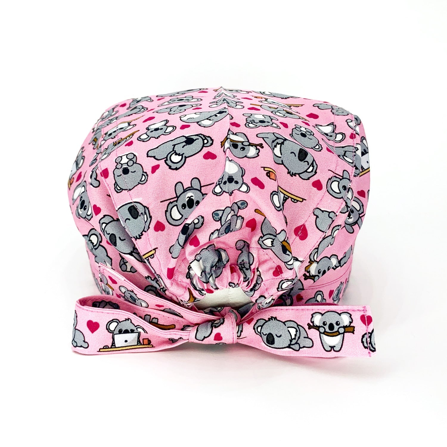 Un bestseller assoluto! Mille tenerissimi koala grigi e cuoricini magenta si sposano alla perfezione con il rosa di sfondo che abbiamo scelto per illuminare il tuo outfit lavorativo