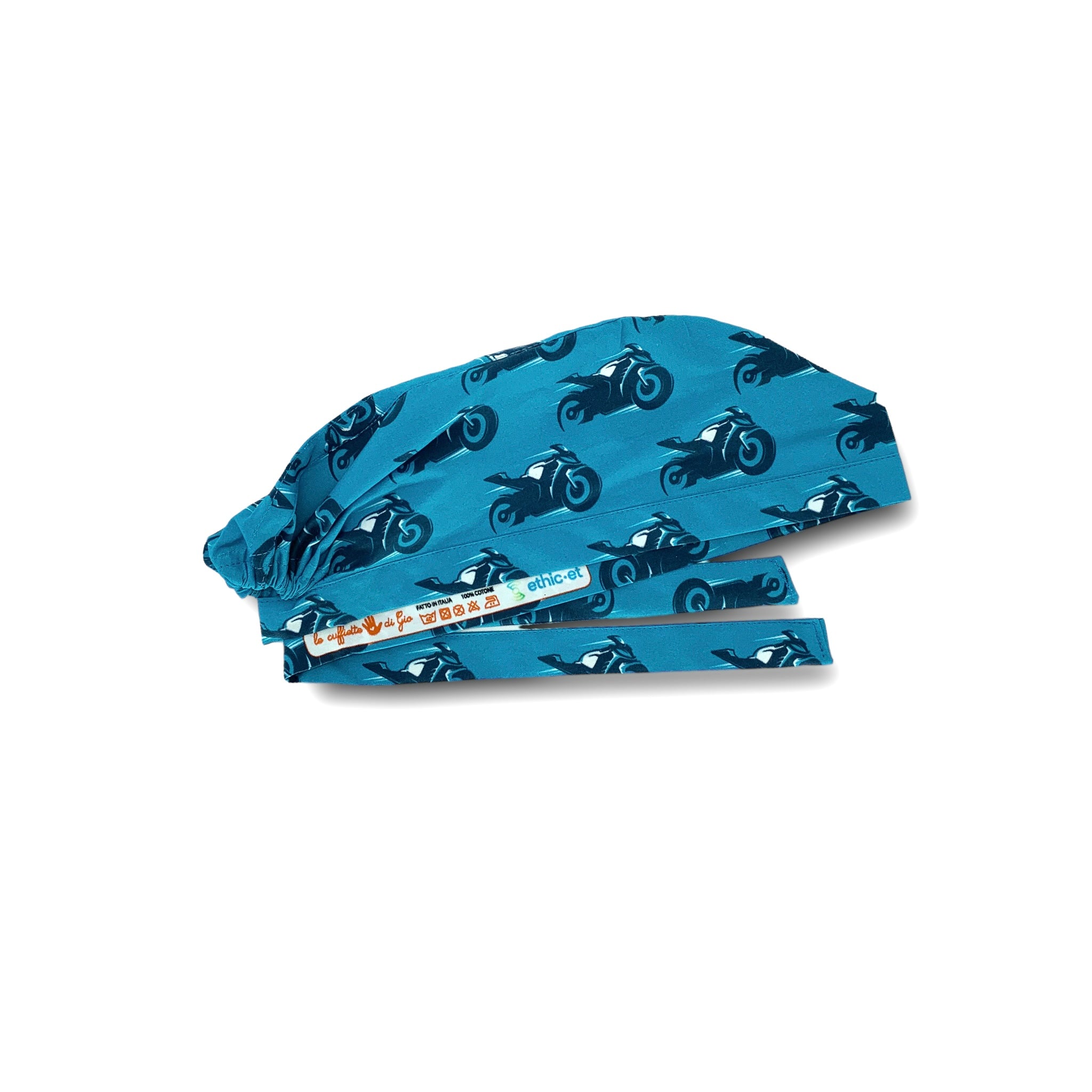 Un pattern semplice con una moto da corsa che sfreccia veloce sollevandosi dal suolo; moto blu e bianca su sfondo azzurro