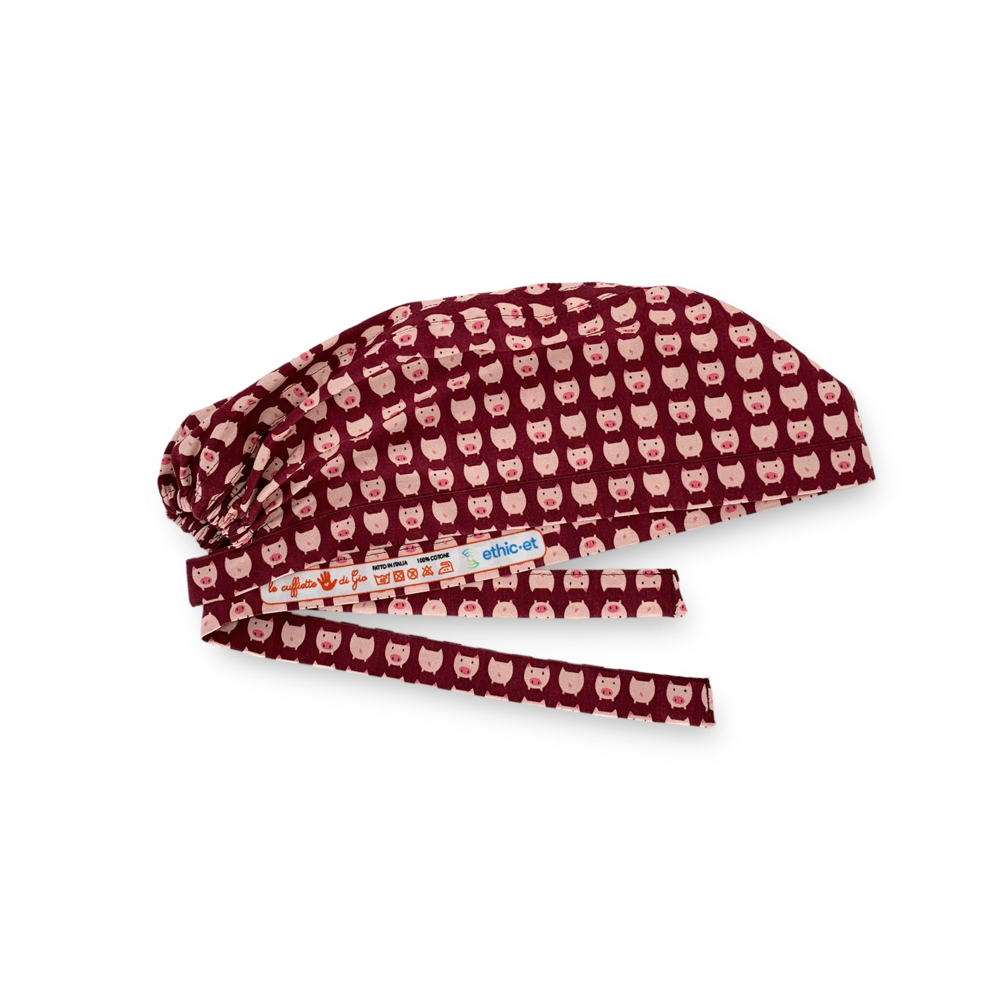 Tanti piccoli maialini rosa su sfondo bordeaux