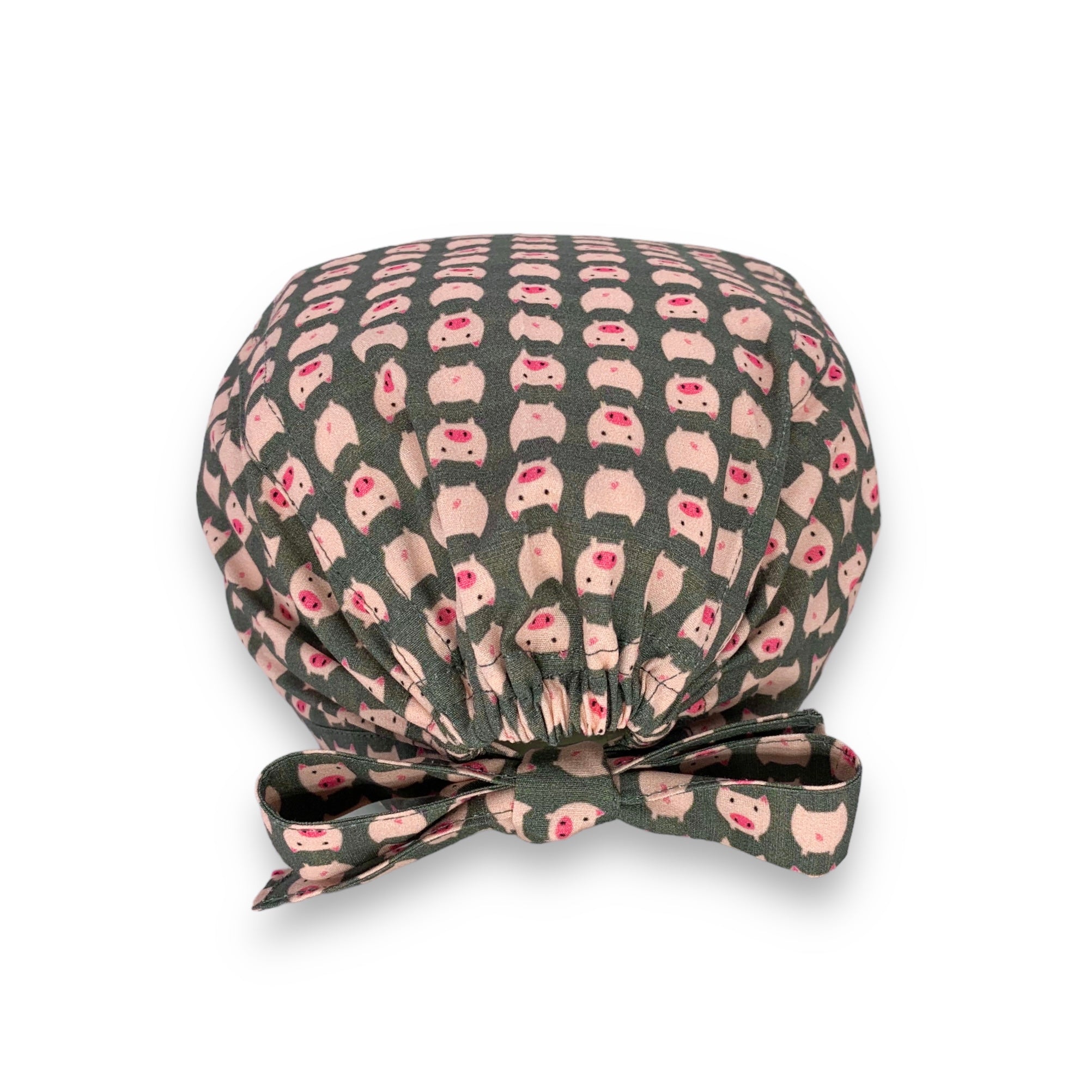 Tanti piccoli maialini rosa su sfondo grigio