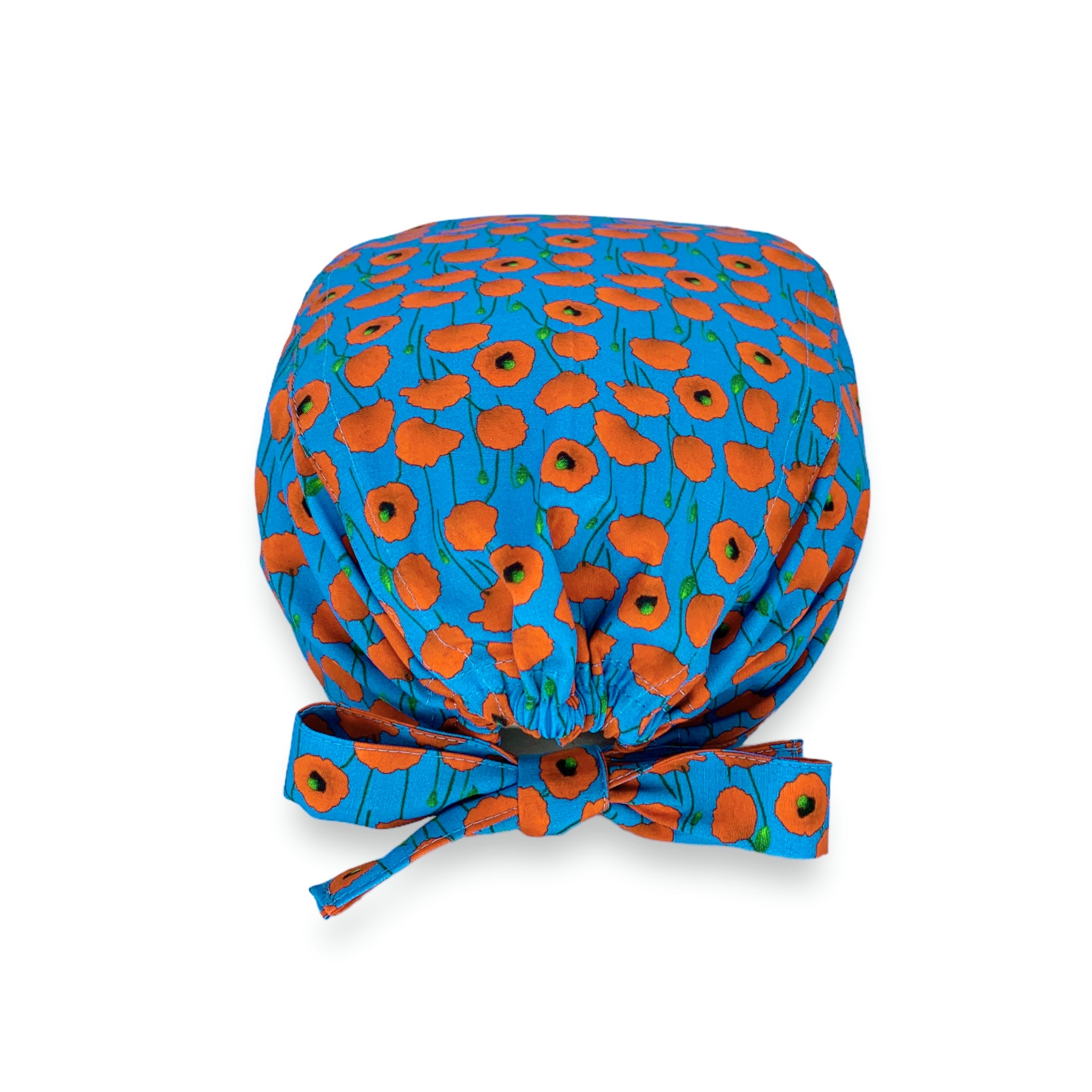 Cuffietta chirurgica azzurro intenso con piccoli papaveri rossi che cadono come pioggia