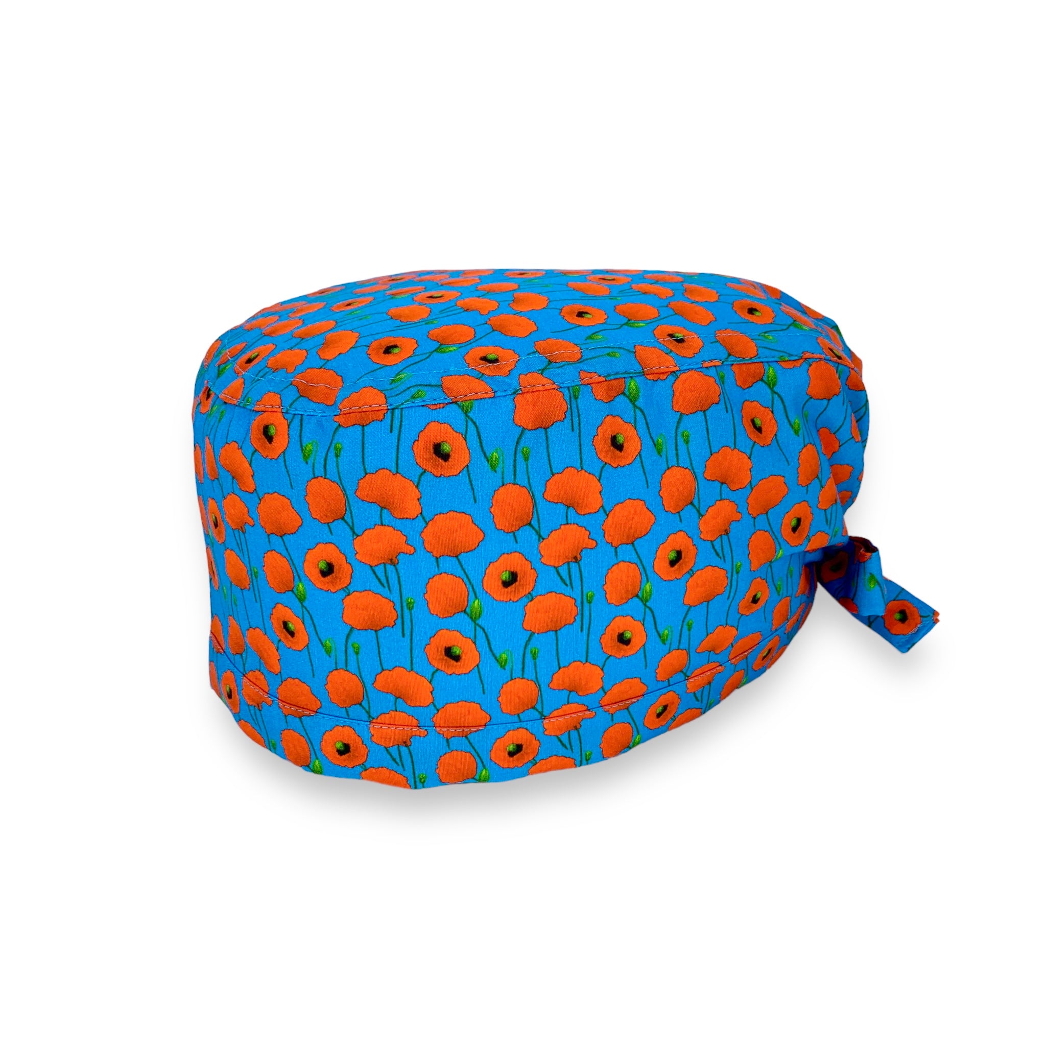 Cuffietta chirurgica azzurro intenso con piccoli papaveri rossi che cadono come pioggia