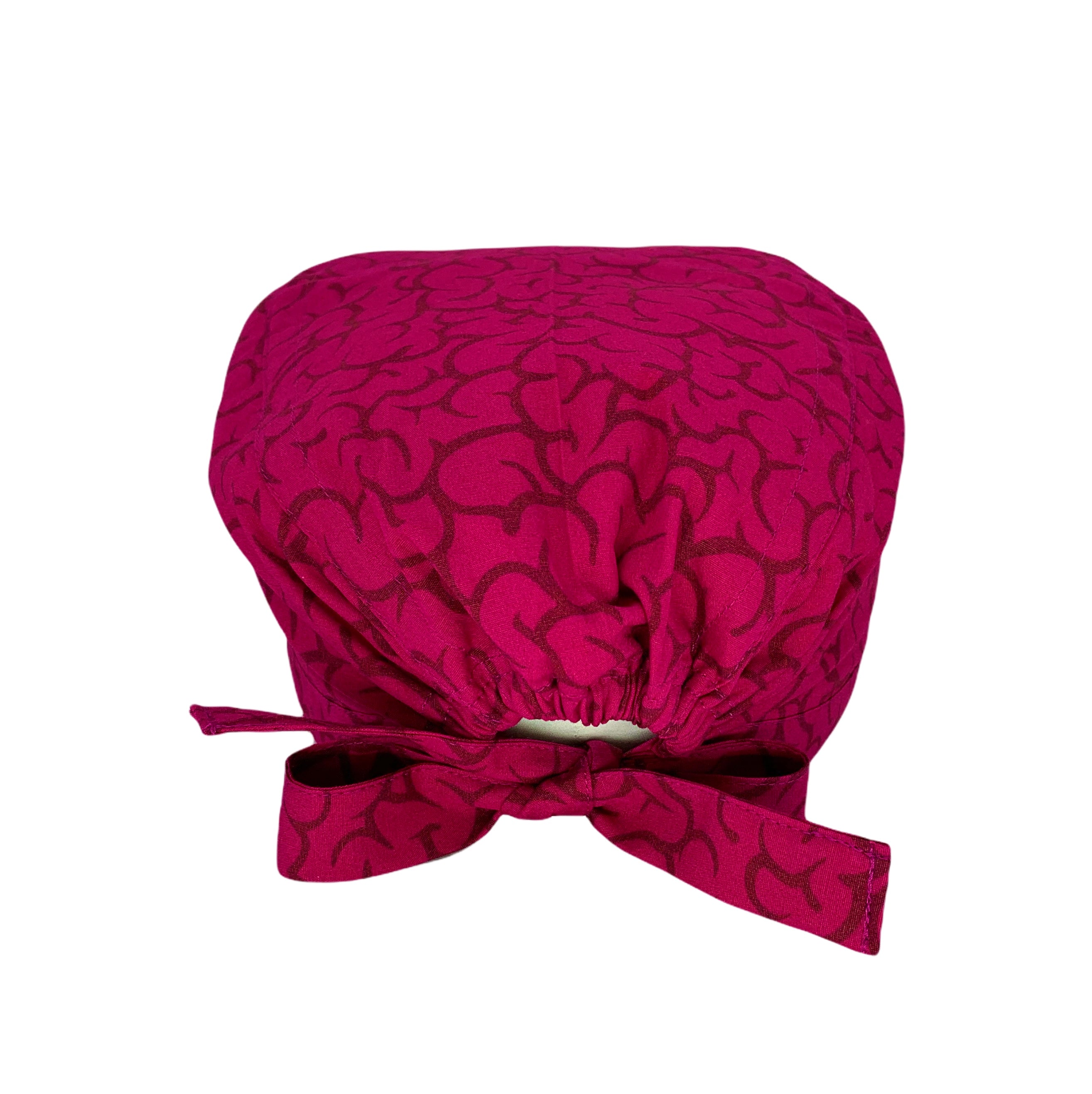 Cuffietta chirurgica con una riproduzione delle rugosità della corteccia cerebrale, in un'intrigante abbinamento di magenta e bordeaux