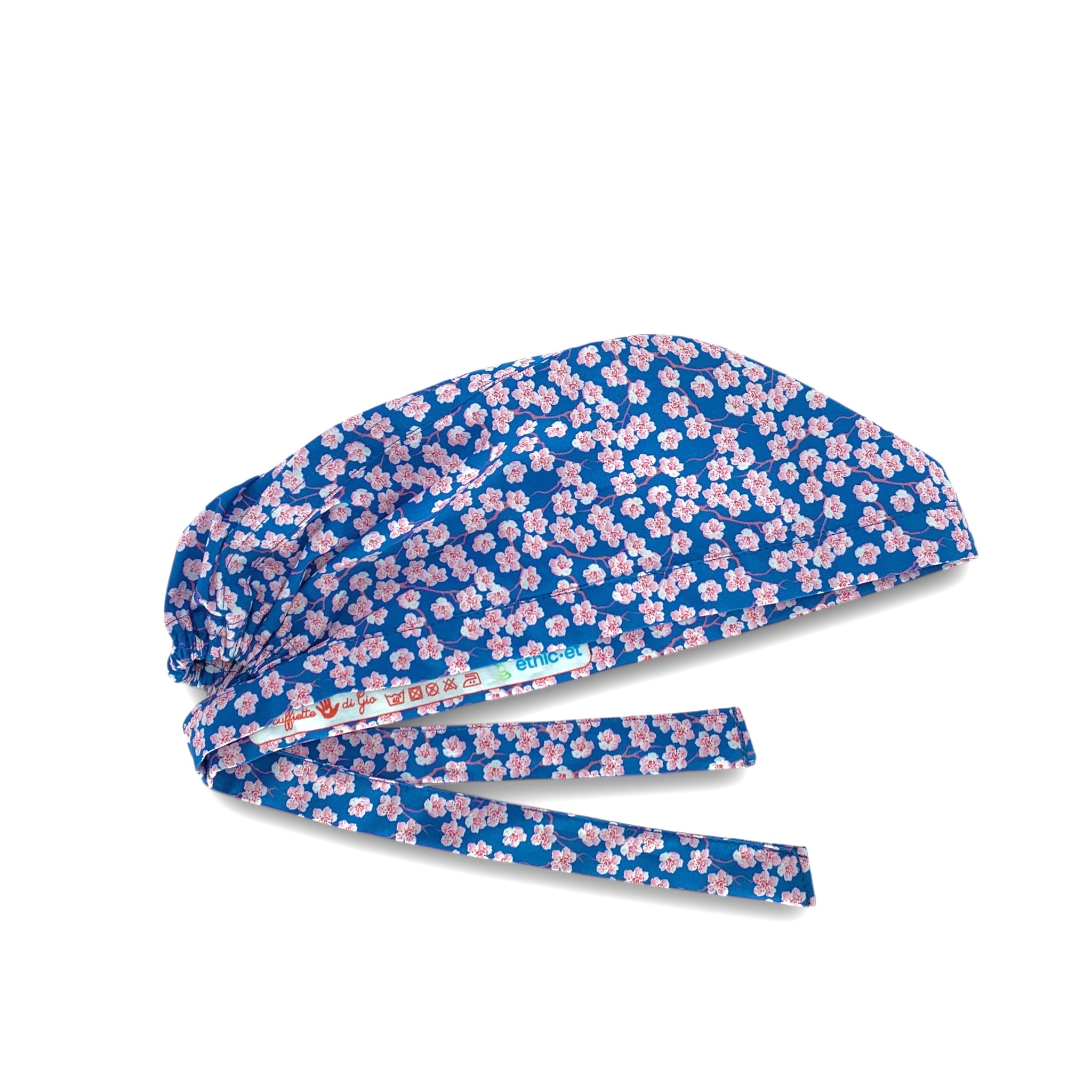 Piccoli fiori di ciliegio rosa su base blu medio