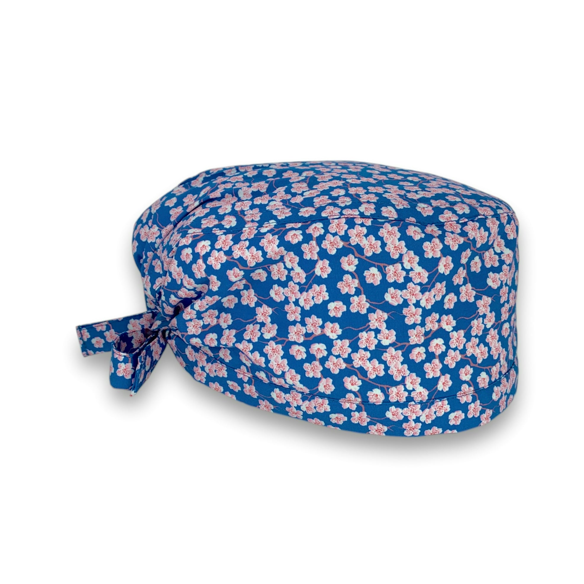 Piccoli fiori di ciliegio rosa su base blu medio