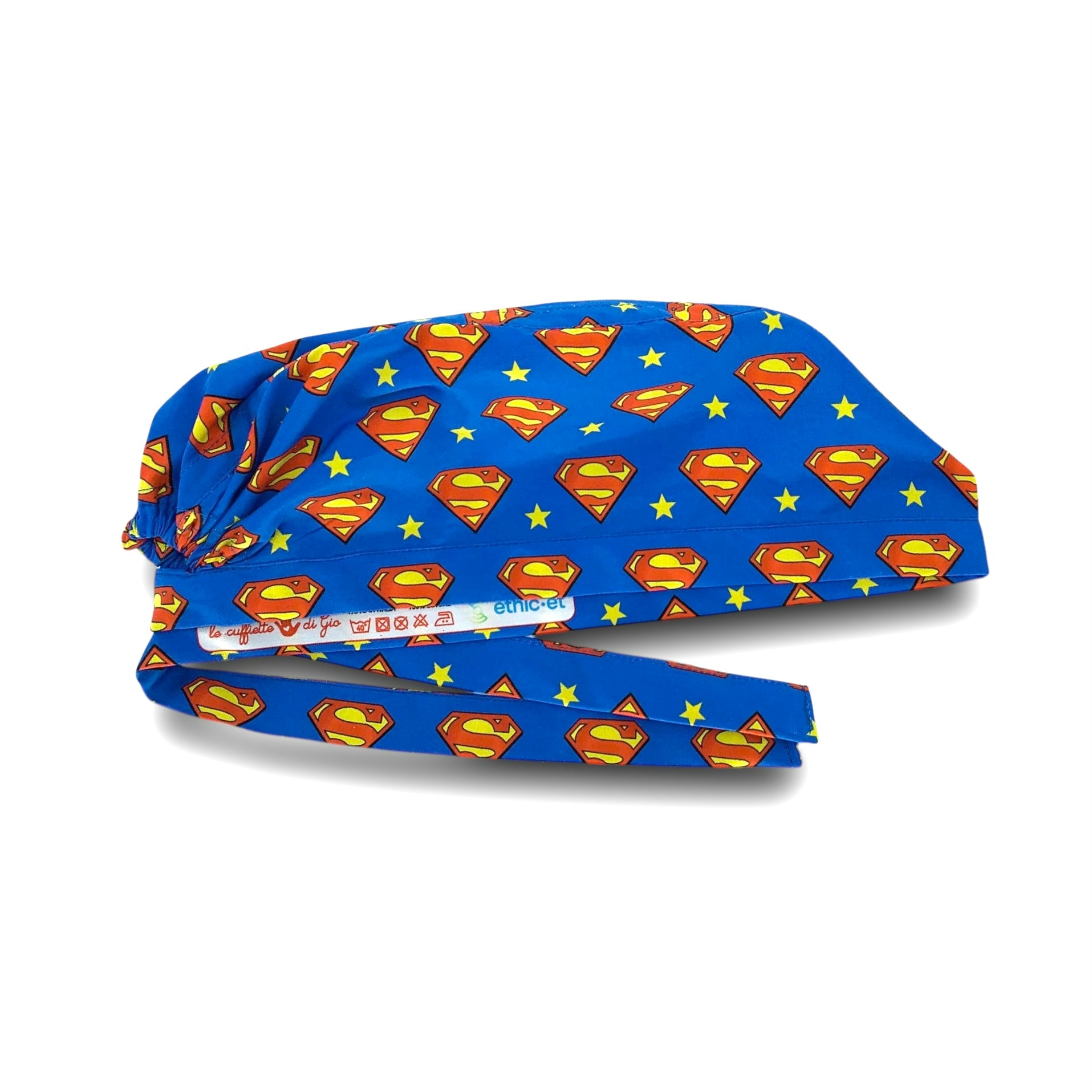 Cuffietta chirurgica blu cobalto con logo di Superman alternato a una stellina gialla in un semplice pattern geometrico