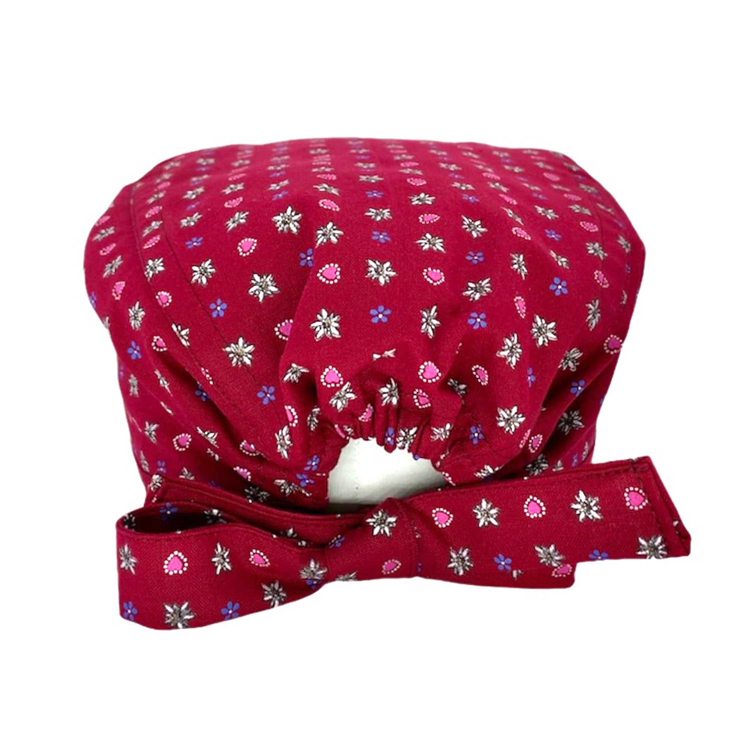 Cuffietta chirurgica in tela di cotone originale tirolese, base tinta unita bordeaux con motivo di piccole stelle alpine, genziane e cuoricini