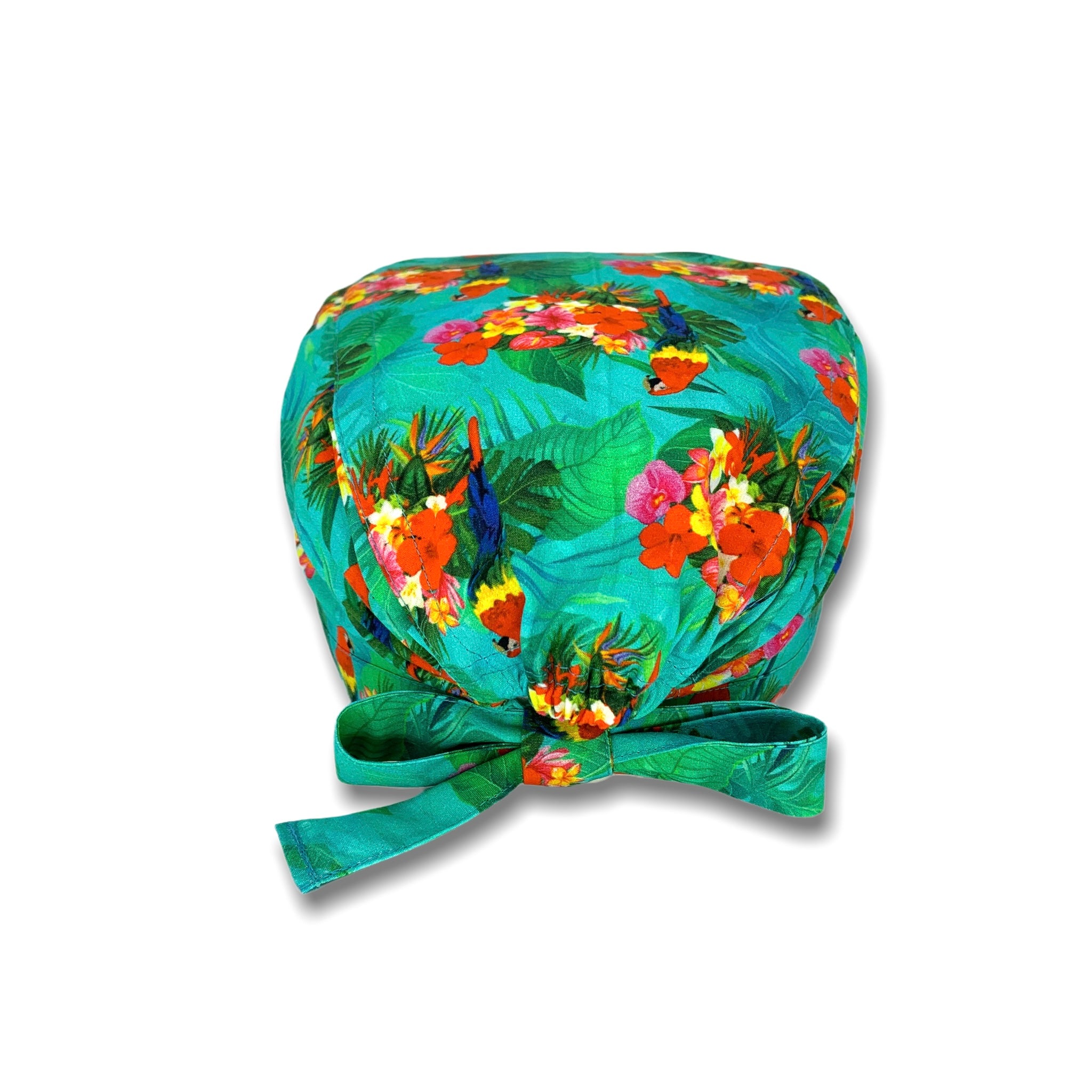 Cuffietta chirurgica verde con foglie tropicali, cacatua con lunga coda colorata in mezzo a un boquet di fiori tropicali