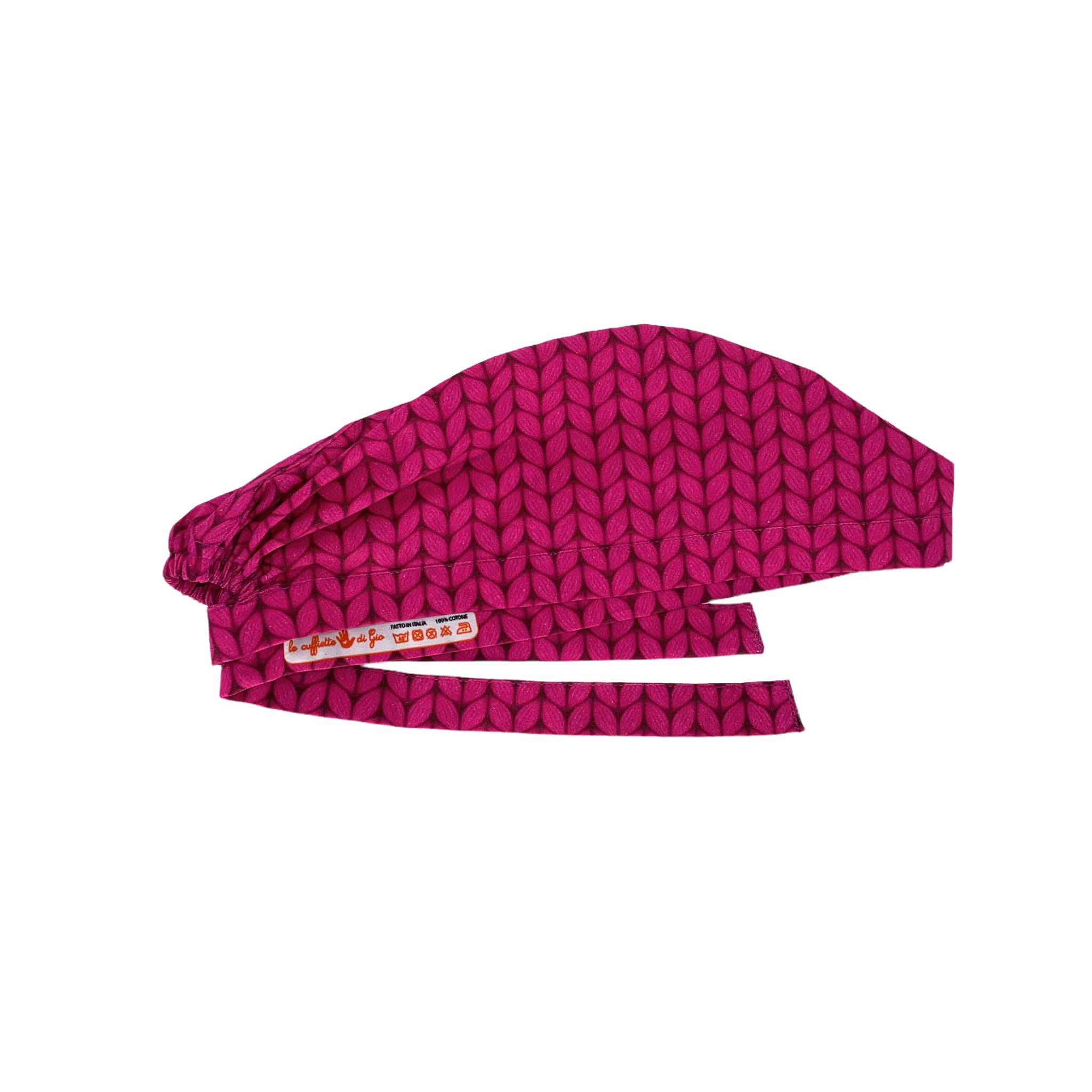 Una stampa che riproduce il lavoro a maglia, sfondo magenta