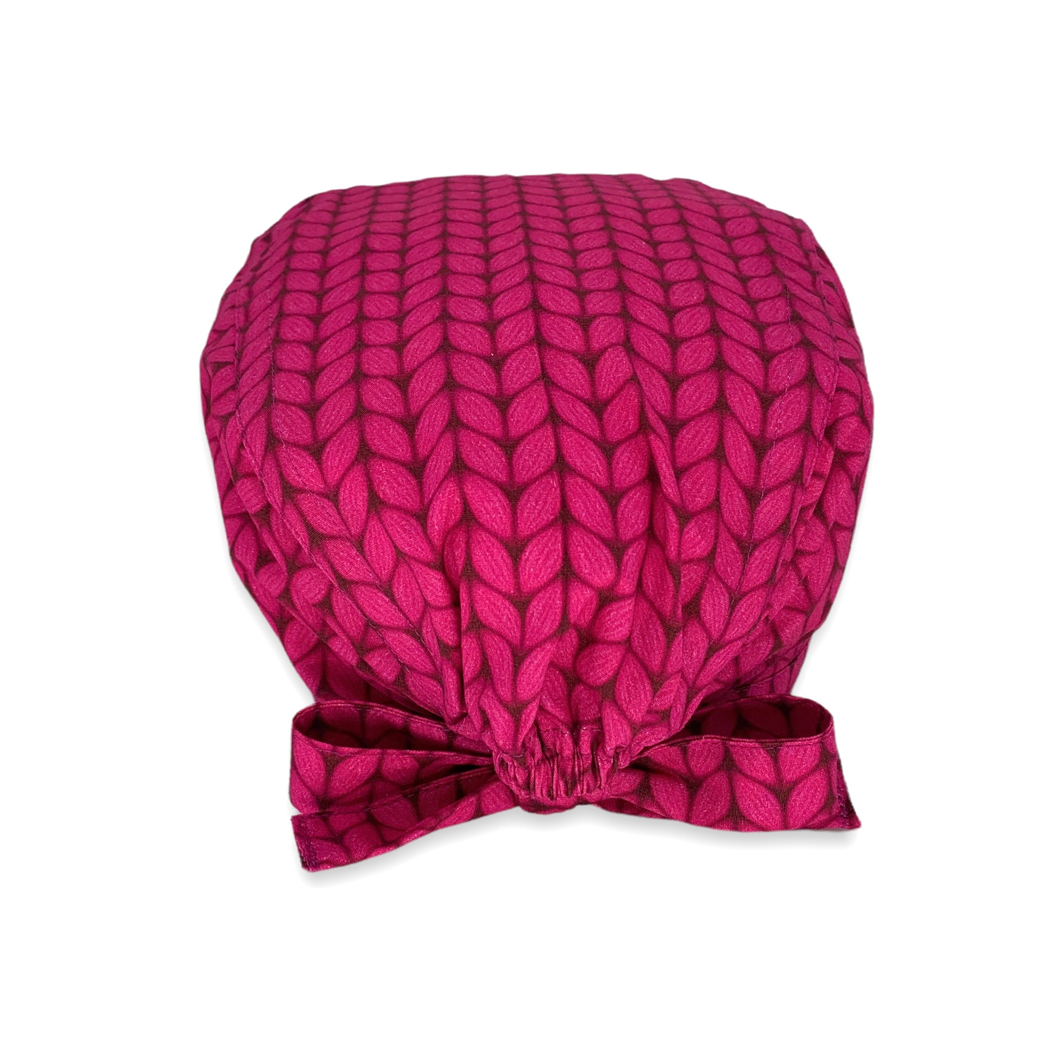 Una stampa che riproduce il lavoro a maglia, sfondo magenta