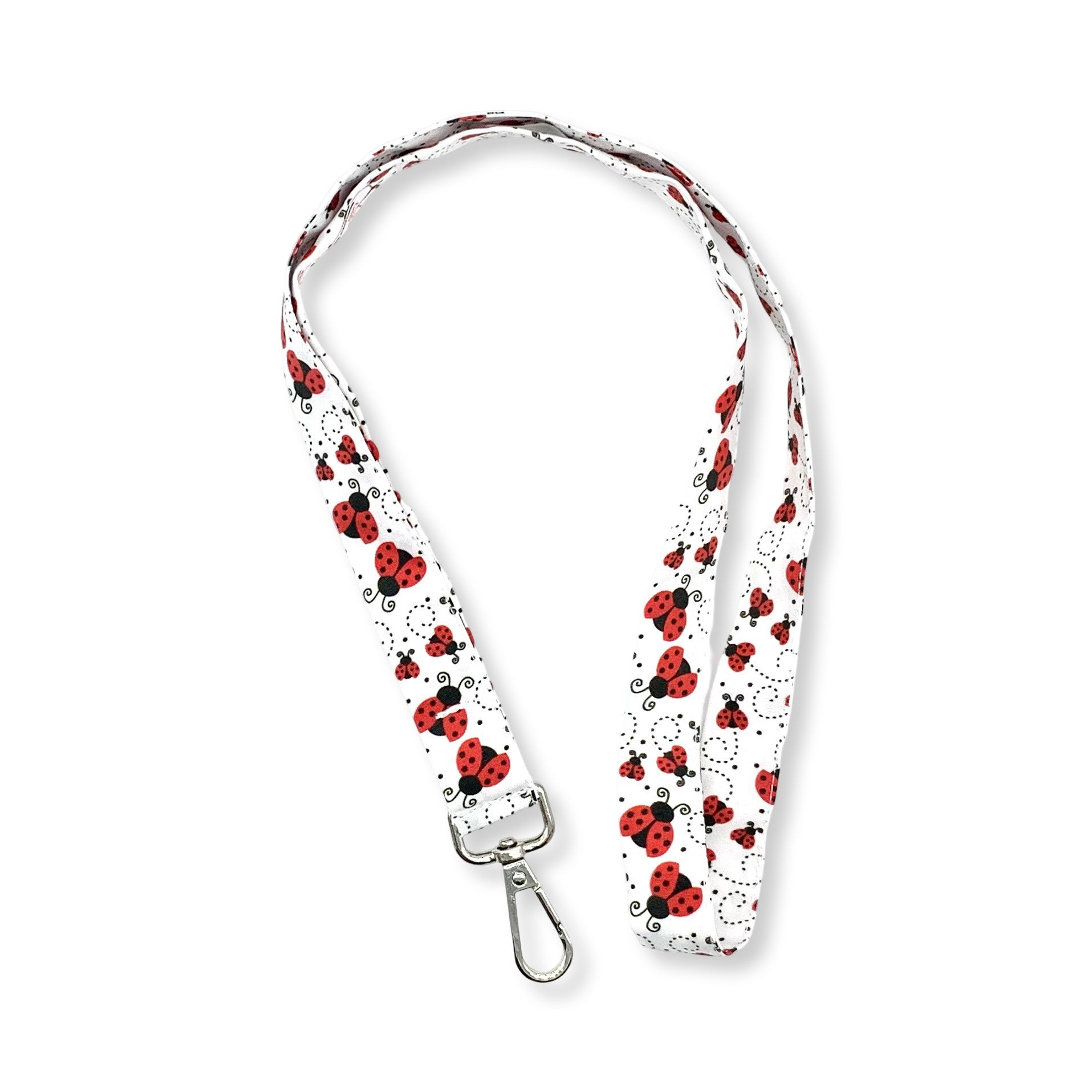 La fascetta da collo portabadge portafortuna per eccellenza! Tante piccole coccinelle svolazzanti su sfondo bianco, da abbinare alla tua cuffietta Coccinelle è lunga 45 cm e corredata di moschettone in metallo separabile per il lavaggio grazie al bottone automatico 