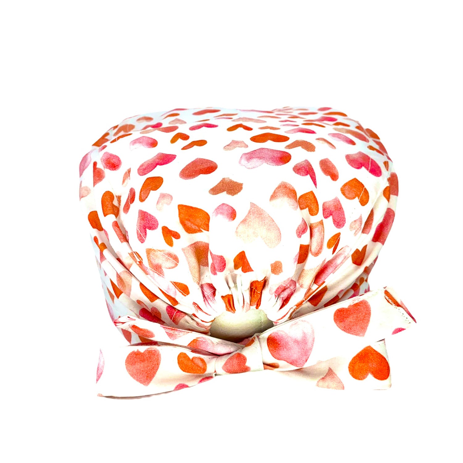 Cuffietta chirurgica con tanti cuoricini dipinti sui toni caldi del rosa e dell'arancio su base bianca