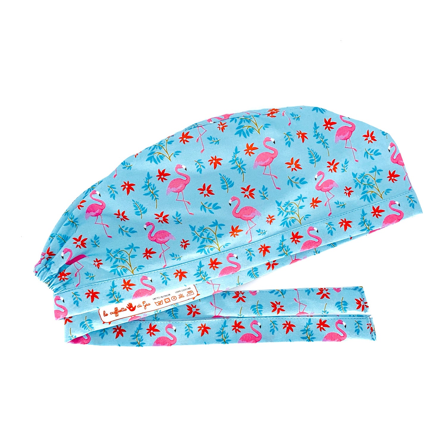 Cuffietta cirurgica con una composizione di colori imbattibile: sfondo azzurro, fenicotteri rosa e piccoli fiorellini rossi.