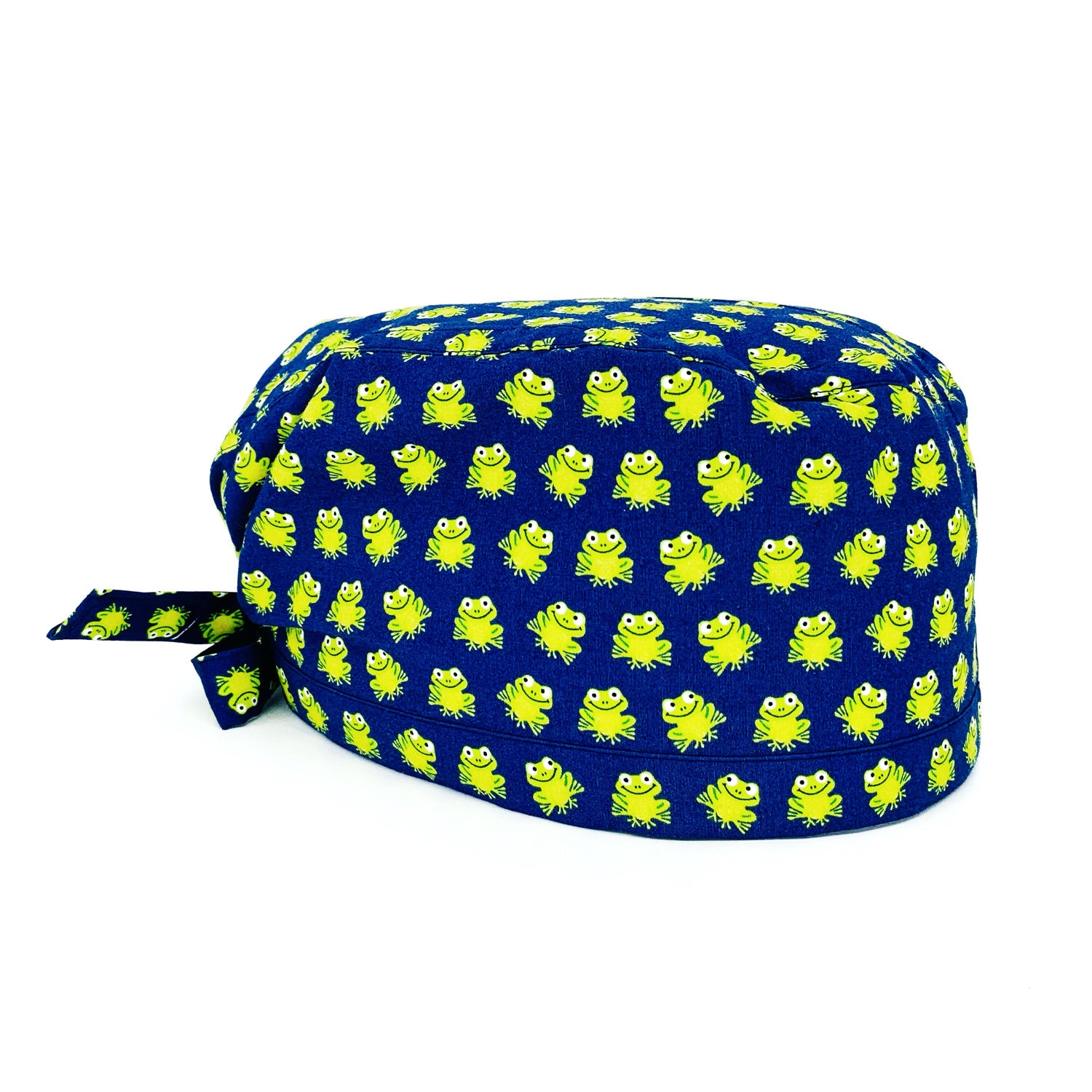 Cuffietta chirurgica con tante piccole ranocchie verde acido su sfondo blu, un pattern semplice e una combinazione di colori energizzante