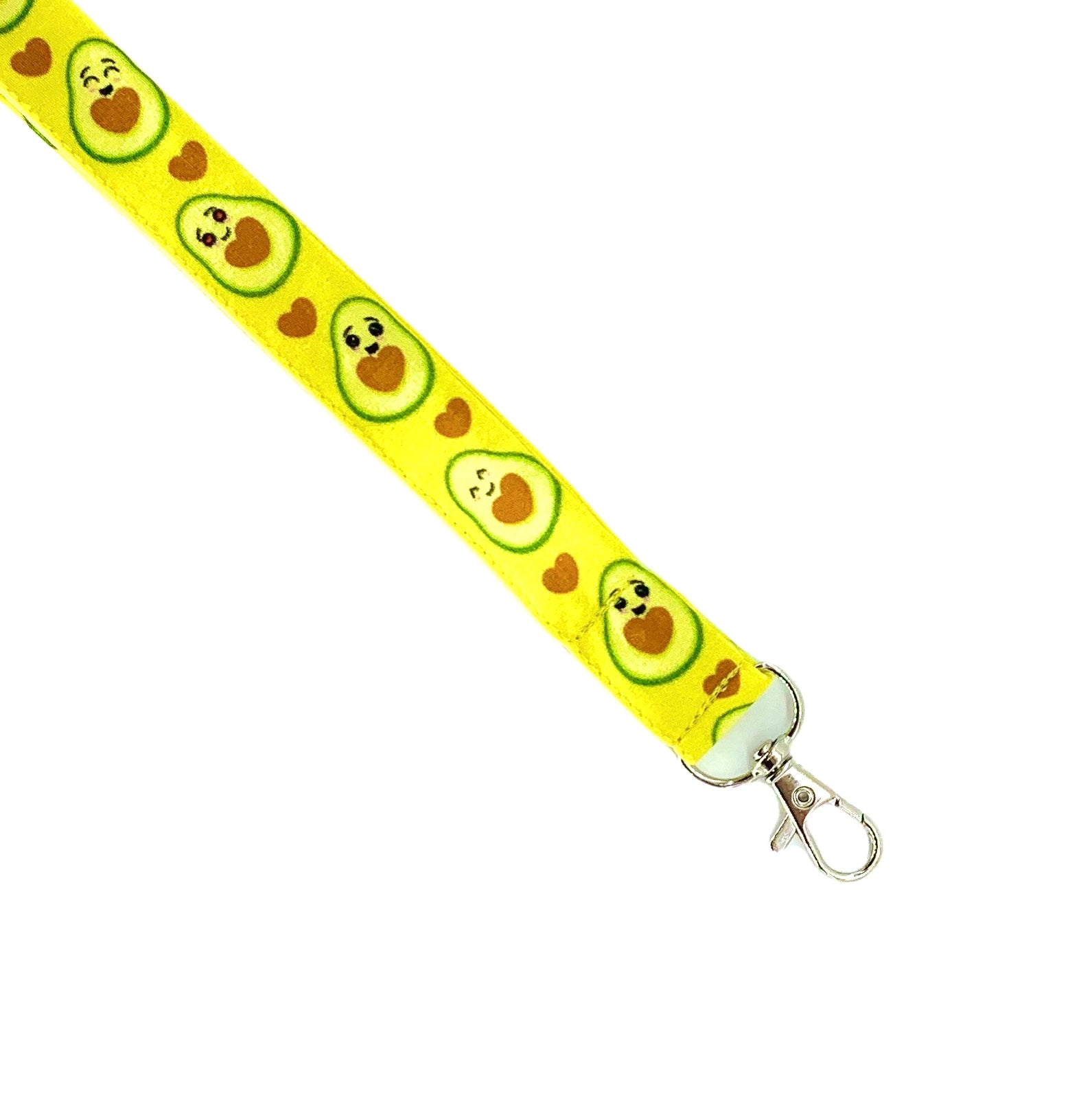 Una fascetta da collo portabadge simpatici avocado tagliati a metà svelano un cuore morbido, deliziose tonalità di verde e marrone che si abbinano perfettamente sulla base giallo limone.