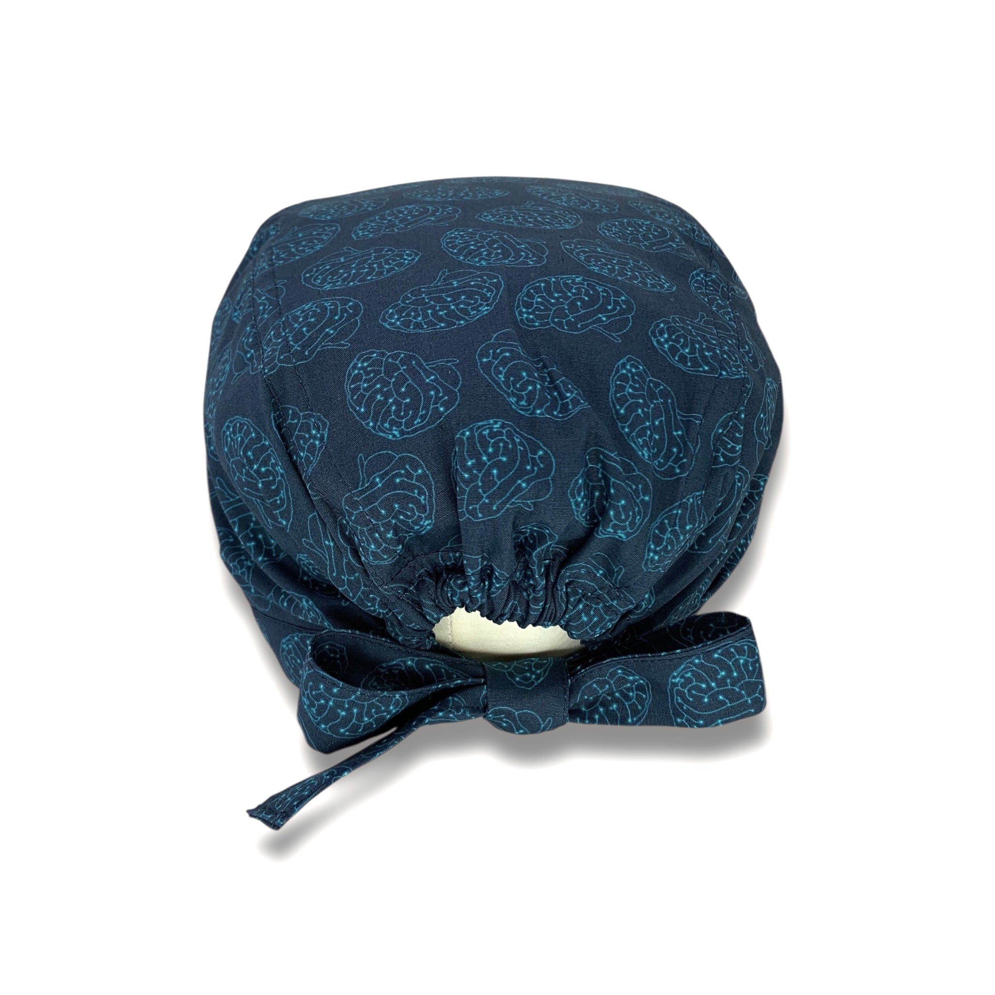 Una cuffietta chirurgica dedicata alla neurochirurgia: il cervello stilizzato in versione elettronica in colore azzurro su sfondo blu scuro