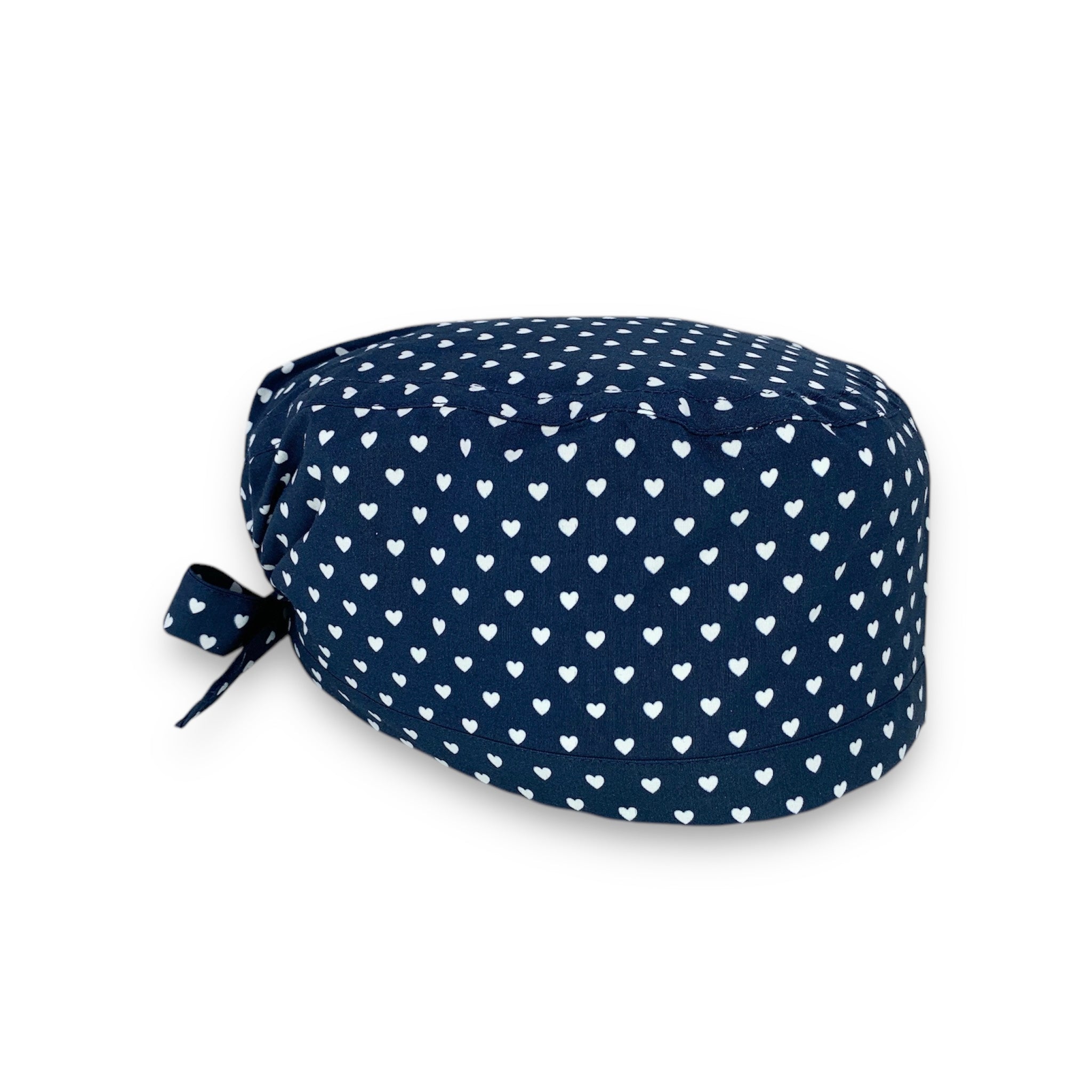 Piccoli cuoricini bianchi come pois su base blu. Semplice ed elegante.