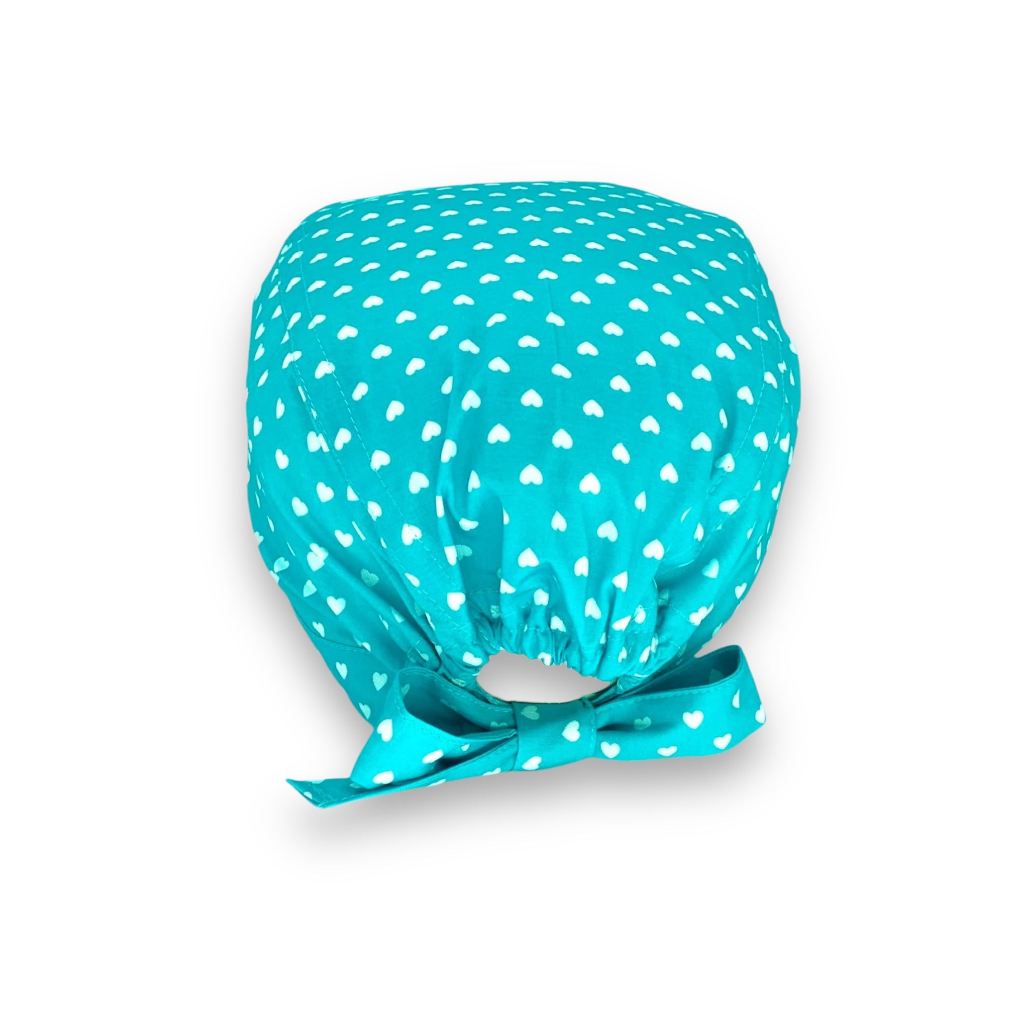 Piccoli cuoricini come pois su base tinta unita.
Cuori bianchi su turchese. Semplice ed elegante.