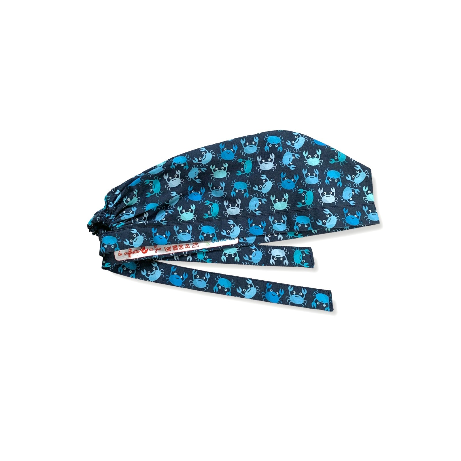 Una cuffia chirurgica simpatica ed elegante al tempo stesso, con una miriade di granchietti colorati tono su tono rispetto alla base blu