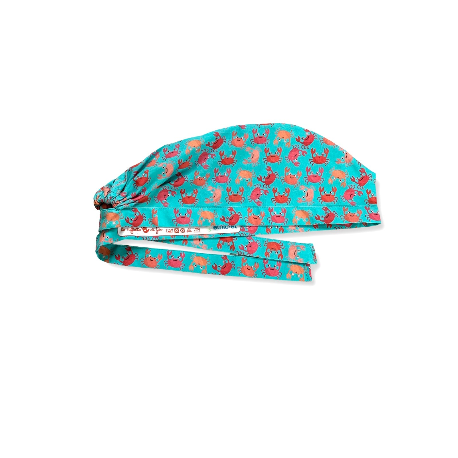 Una cuffia chirurgica simpatica ed elegante al tempo stesso, con una miriade di granchietti colorati tono su tono rispetto alla base verde acqua