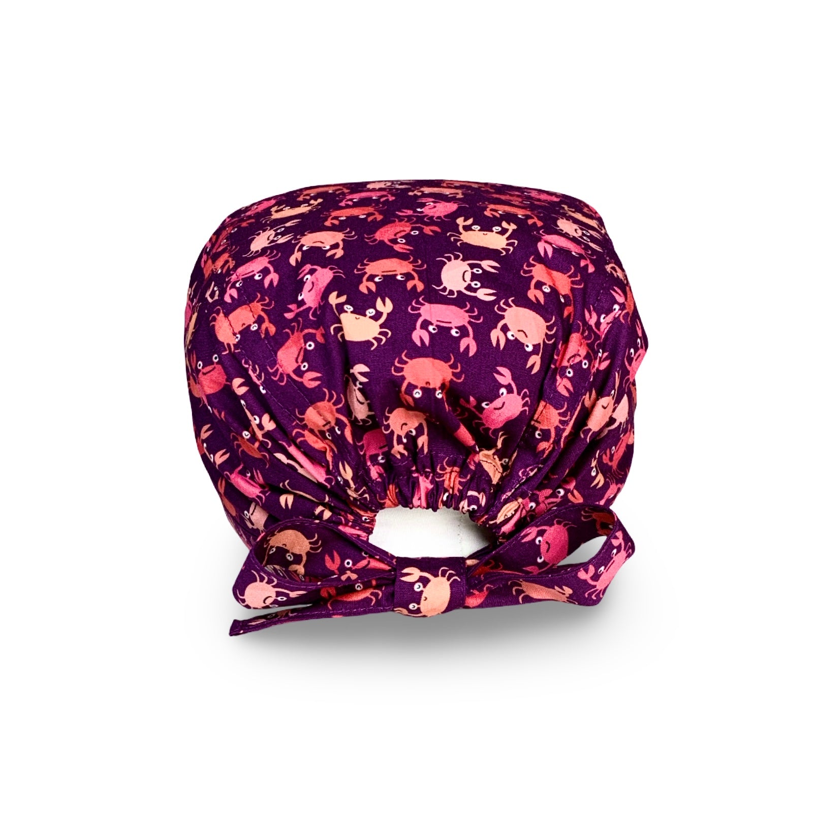 Una cuffia chirurgica simpatica ed elegante al tempo stesso, con una miriade di granchietti colorati tono su tono rispetto alla base viola