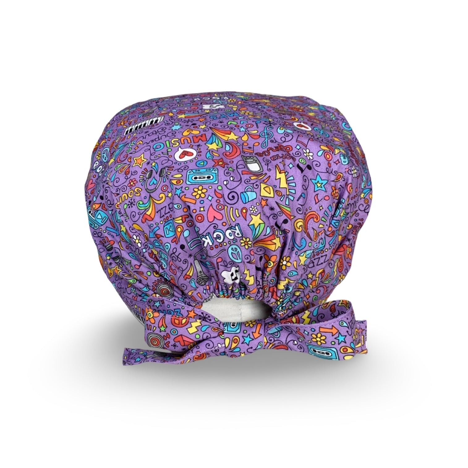 Una compilation di colori imperdibili per questa cuffietta chirurgica che celebra l'amore per la musica in tutte le sue forme, con un accattivante e ricchissima grafica pop, su sfondo lilla.