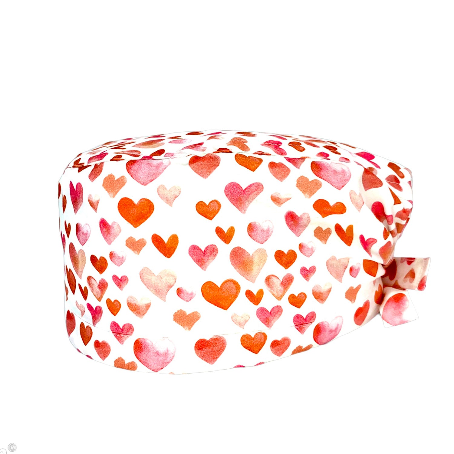 Cuffietta chirurgica con tanti cuoricini dipinti sui toni caldi del rosa e dell'arancio su base bianca